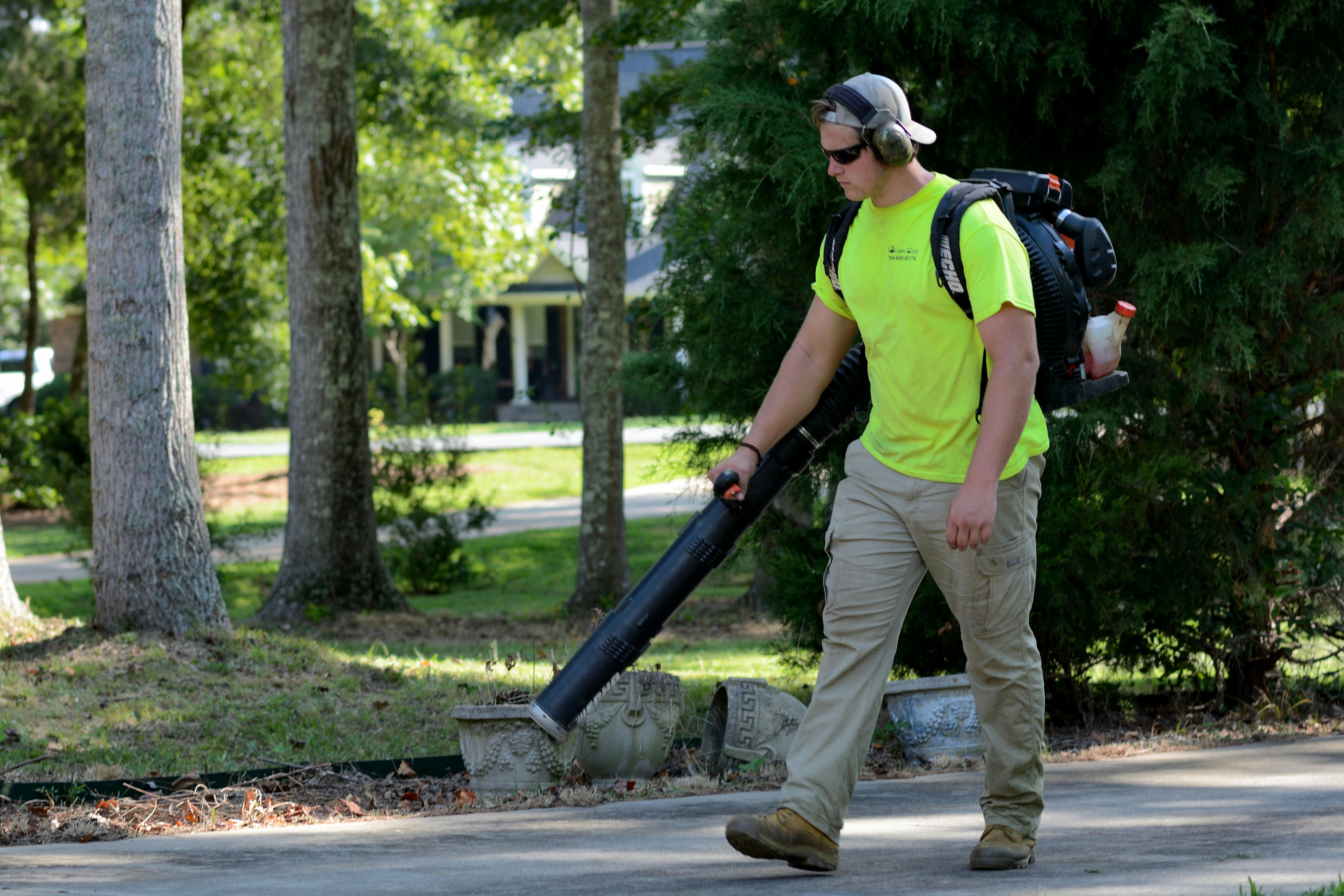 GreenEdge Landscaping professional performing yard cleanup in San Francisco, CA